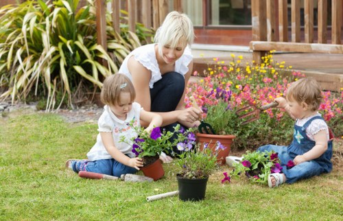 Front garden with gardener tools and neat lawn